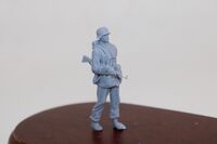 German WWII Waffen SS Grenadier with Stahlhelm and Sturmgewehr 44 - Image 1